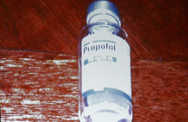 a-bottle-of-propofol-lies-under-a-side-t