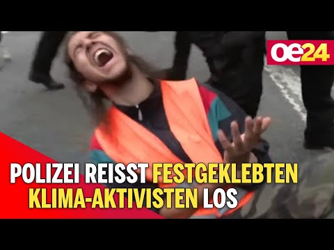 Youtube: Polizei reisst festgeklebten Klima-Aktivisten los