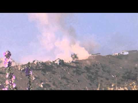 Youtube: شام ريف حماة تل عثمان لحظة انفجار احدى دبابات جيش النظام على يد الجيش الحر 20 5 2014
